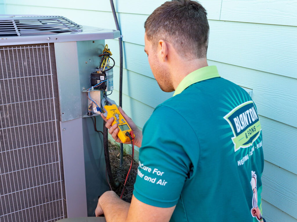 Blanton and Sons tech performing a tune-up on AC unit 