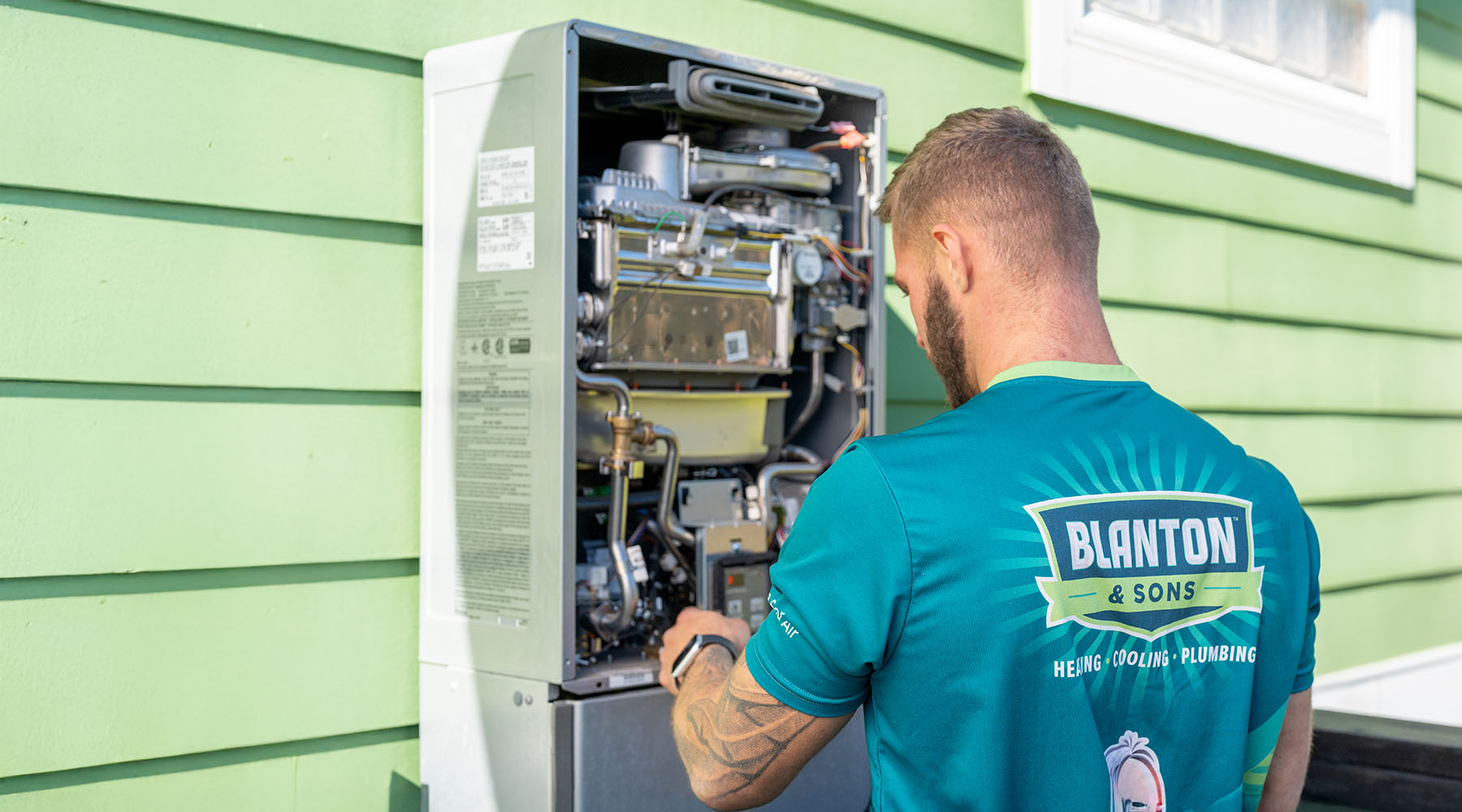 Blanton tech servicing water heater