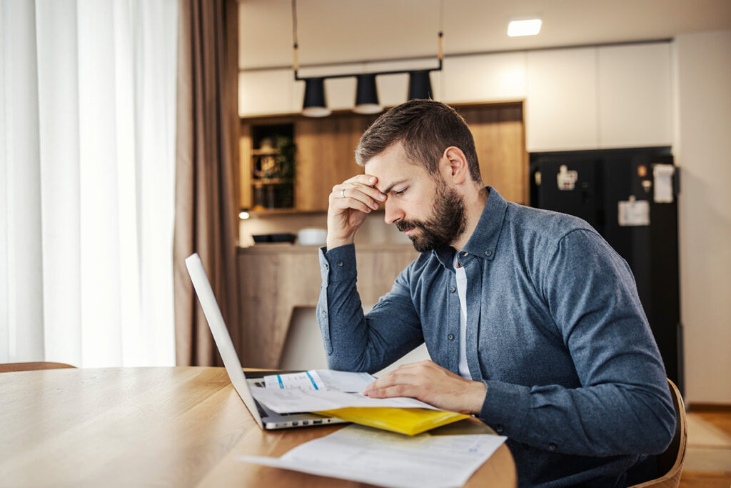 home owner looking at utility bill